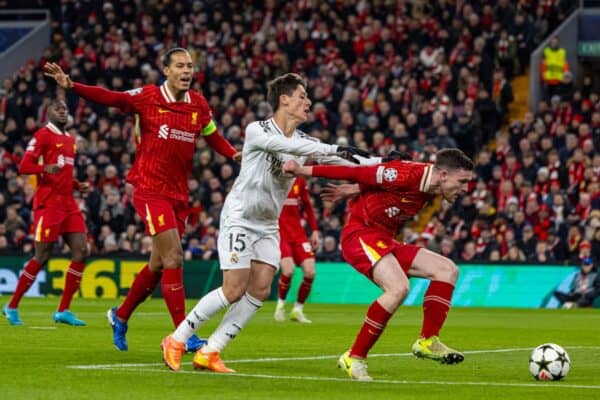 LIVERPOOL, ENGLAND - Wednesday, November 27, 2024: Real Madrid's Arda Güler (L) is denied by Liverpool's Andy Robertson during the UEFA Champions League game between Liverpool FC and Real Madrid CF at Anfield. (Photo by David Rawcliffe/Propaganda)