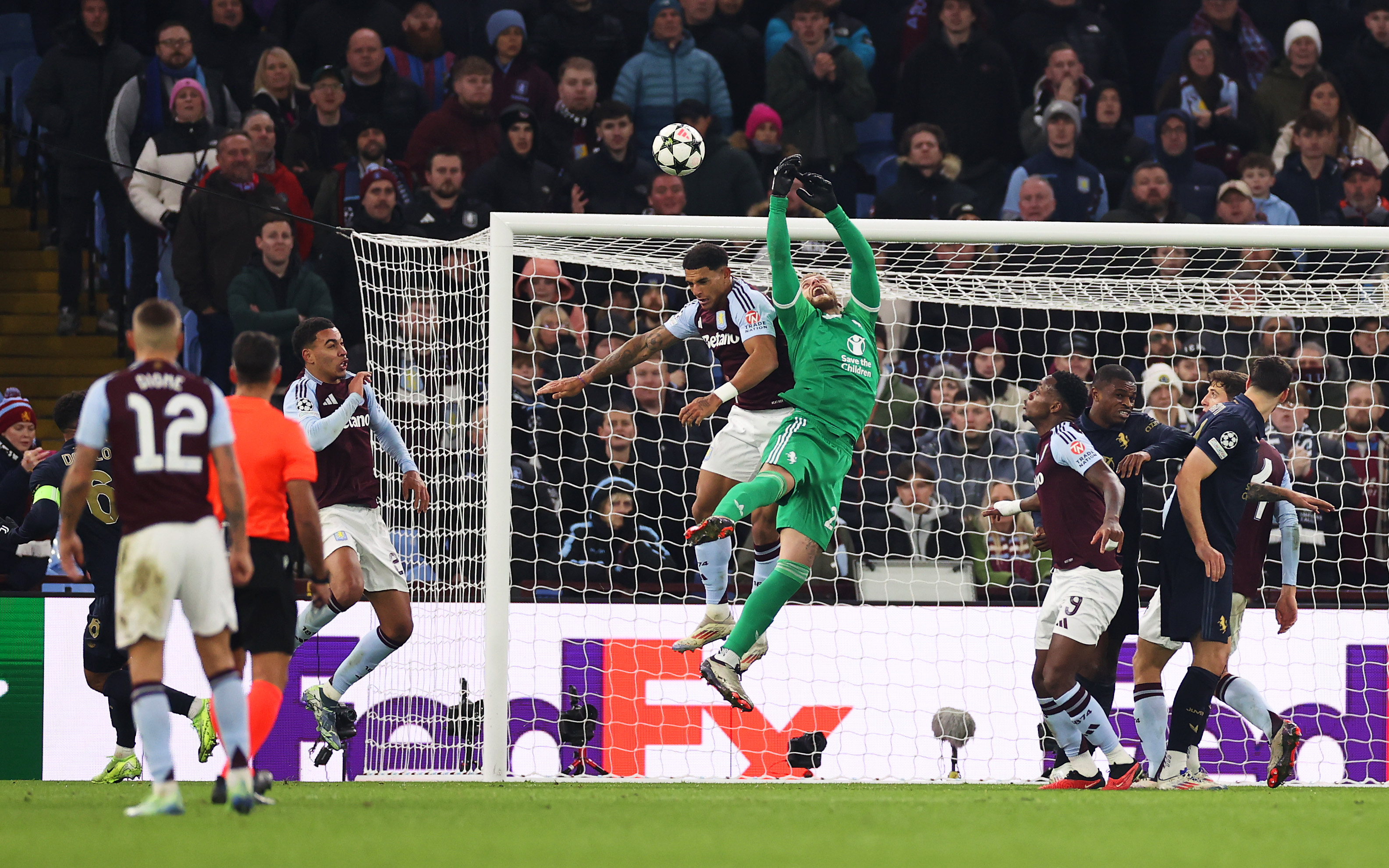 Diego Carlos of Aston Villa fouls Michele Di Gregorio of Juventus