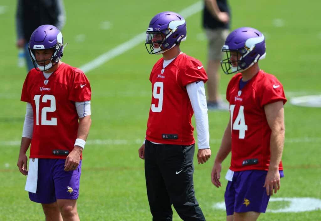 EAGAN, MINNESOTA - JUNE 04: (L-R) Quarterbacks Nick Mullens #12, J.J. McCarthy #9 and Sam Darnold #14 of the Minnesota Vikings practice during Minnesota Vikings mandatory minicamp at Twin Cities Orthopedics Performance Center on June 04, 2024 in Eagan, Minnesota.