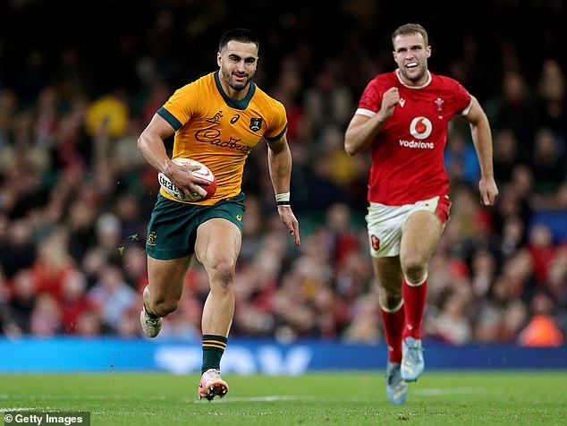 Australia's ooker Matt Faessler and full-back Tom Wright (left) both scored hat-tricks