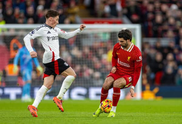 LIVERPOOL, ENGLAND - Saturday, December 14, 2024: Liverpool's Dominik Szoboszlai (R) stops Fulham's Harry Wilson during the FA Premier League match between Liverpool FC and Fulham FC at Anfield. (Photo by David Rawcliffe/Propaganda)