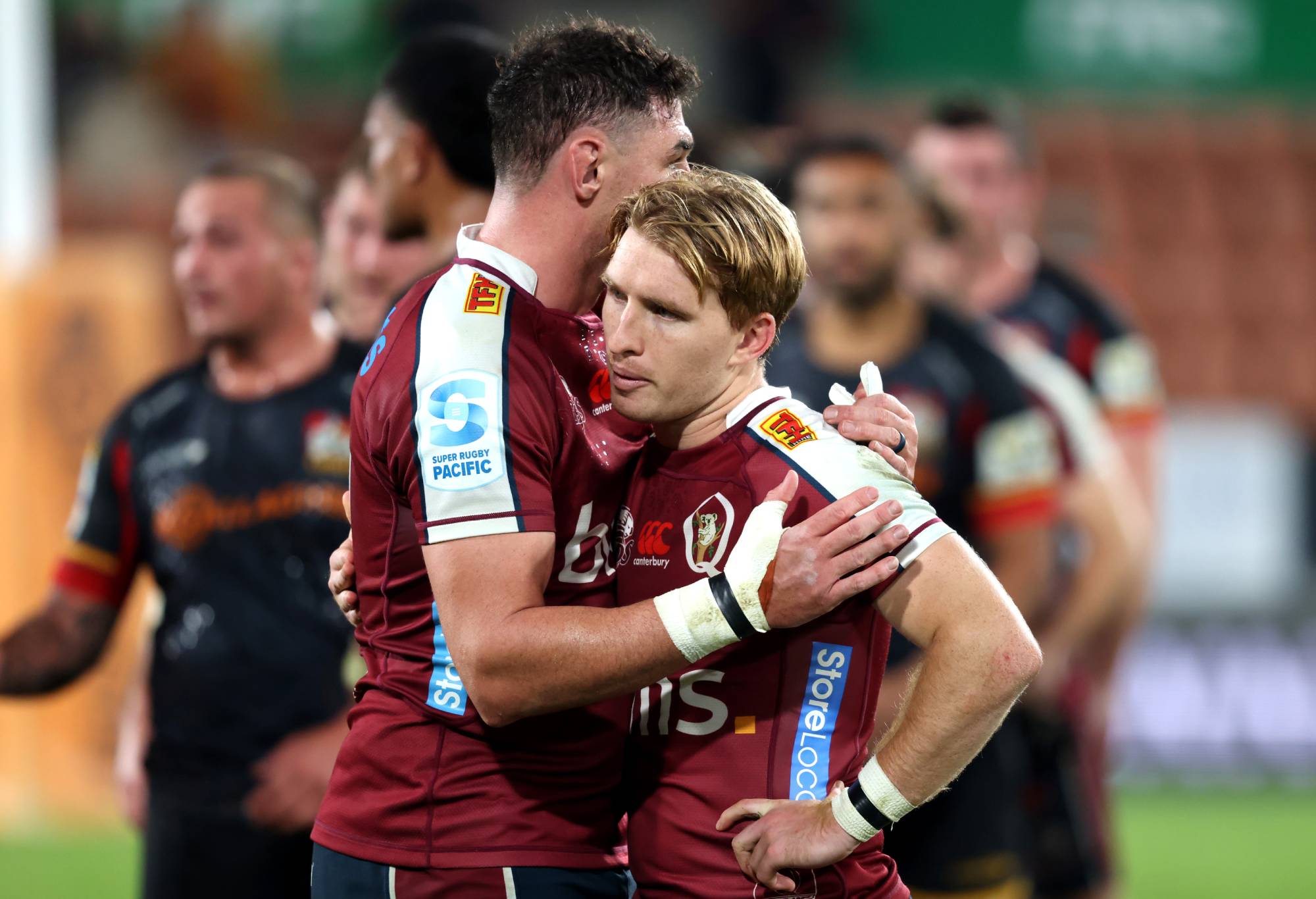 Connor Vest and Tate McDermott of the Reds react after losing the Super Rugby Pacific Quarter Final match between Chiefs and Queensland Reds at FMG Stadium Waikato, on June 07, 2024, in Hamilton, New Zealand. (Photo by Michael Bradley/Getty Images)