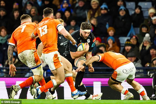 Edinburgh's players try to halt Ally Miller during Glasgow's first leg victory