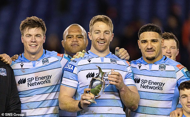 Kyle Steyn lifts the 1872 Cup for Glasgow despite their second-leg defeat