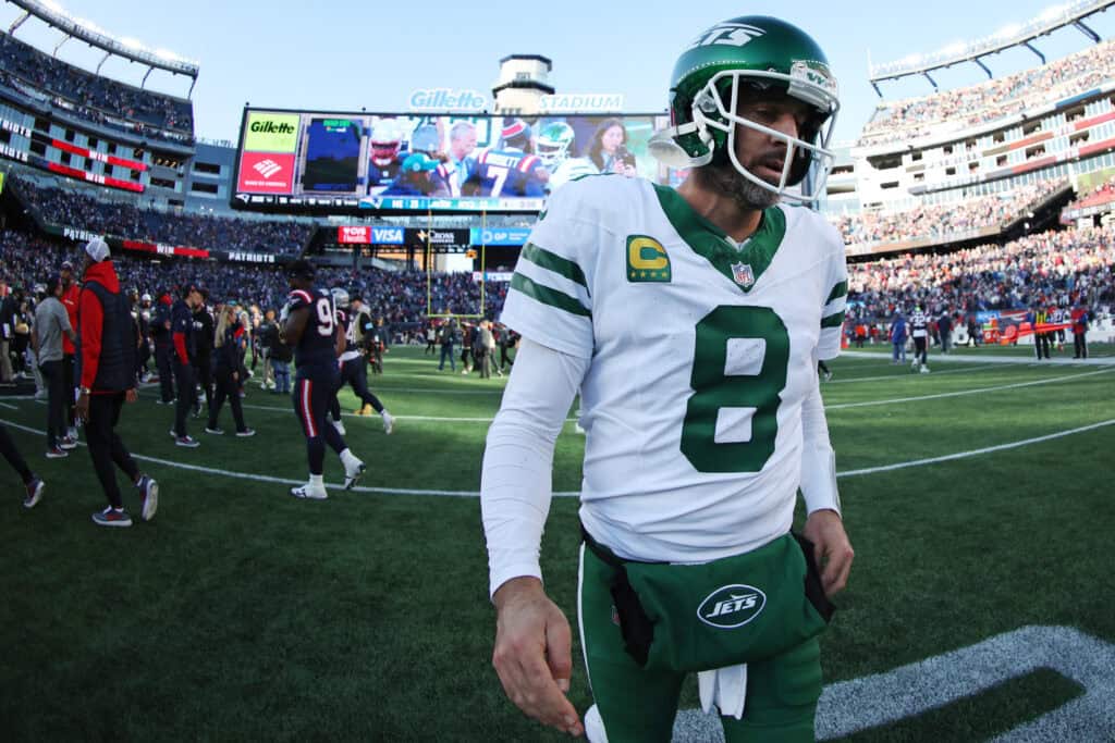 FOXBOROUGH, MASSACHUSETTS - OCTOBER 27: Aaron Rodgers #8 of the New York Jets walks off the field after the game against the New England Patriots at Gillette Stadium on October 27, 2024 in Foxborough, Massachusetts.