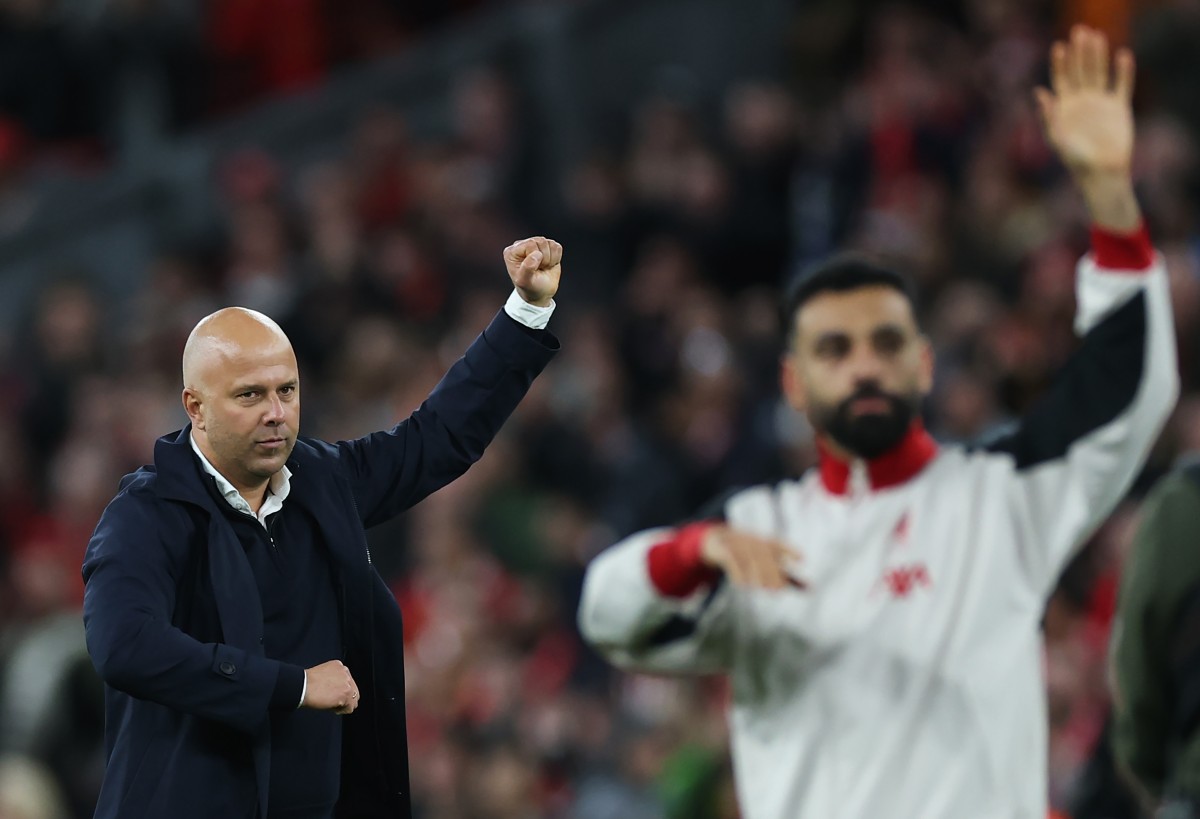 Arne Slot and Mohamed Salah celebrate after Liverpool's win over Man City