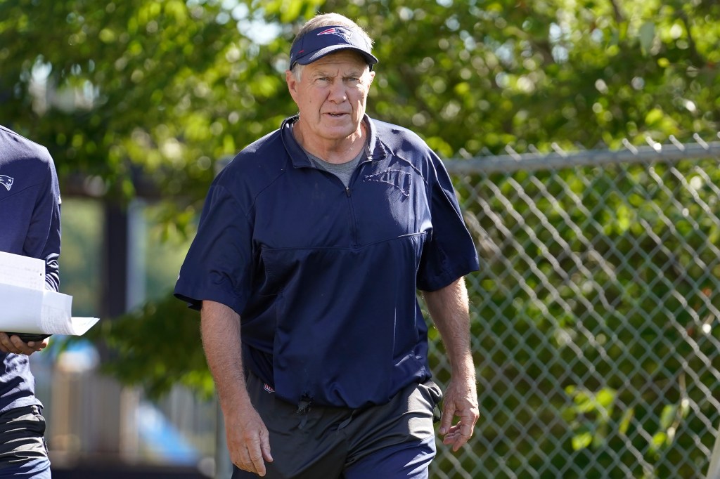 Patriots head coach Bill Belichick steps on the field at the start of an NFL football joint practice with the Carolina Panthers, Tuesday, Aug. 16, 2022, in Foxborough, Mass. 